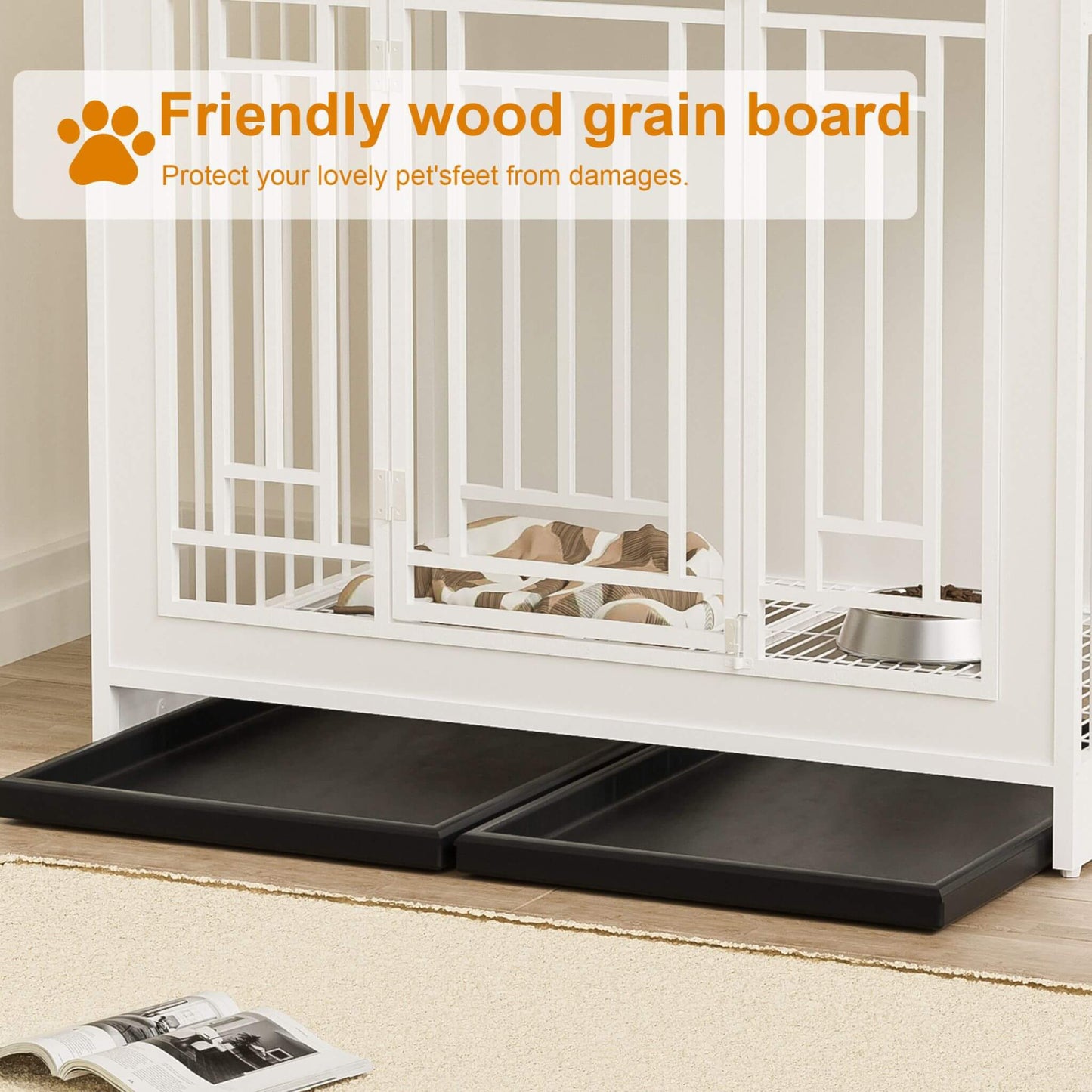 Pet crate with a black tray underneath, featuring a dog inside, on a light wood floor.