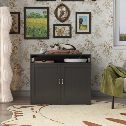 Dark wooden cabinet with a cat on top in a room with floral wallpaper and decorative elements.